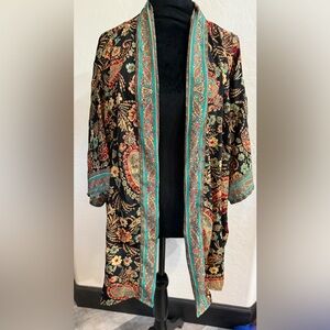 A nice light kimono to wear with so much
NWT!